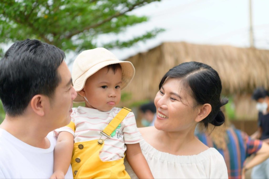 family of three enjoying hoi an vietnam