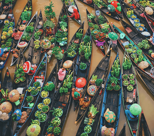 floating market scene with boats laden with products