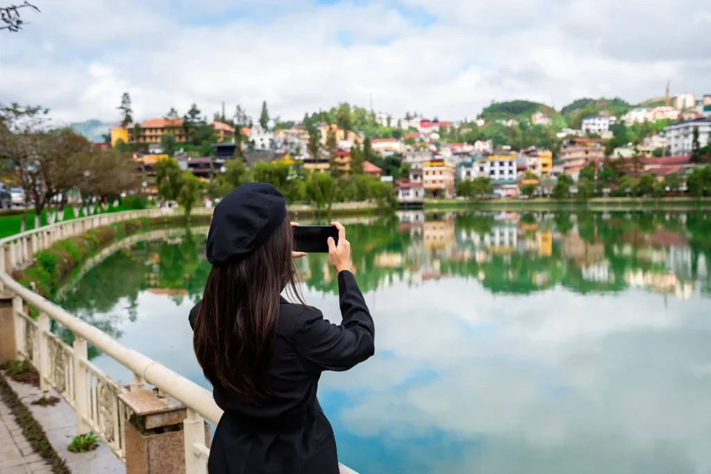 woman taking pictures in vietnam