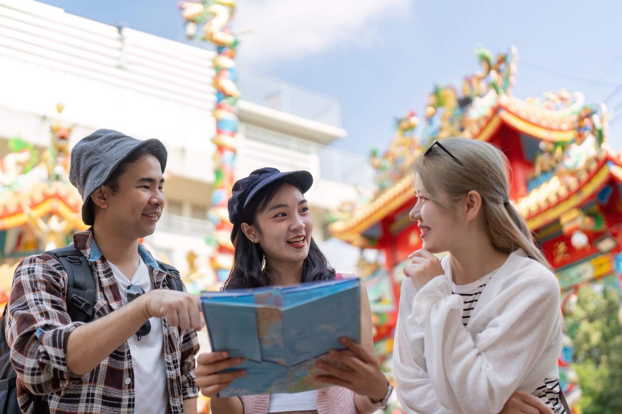 Tourists checking a map near a temple - Vietnamese etiquette for travelers